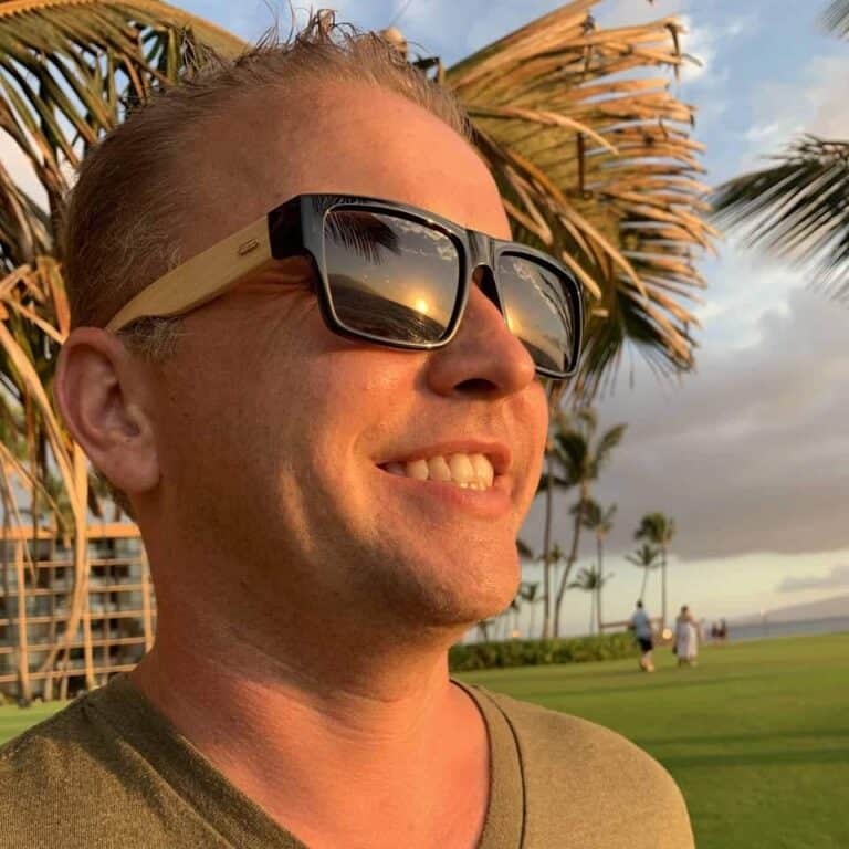 andrew millennial homeowner selfie in front of Pacific/tropical grassy view